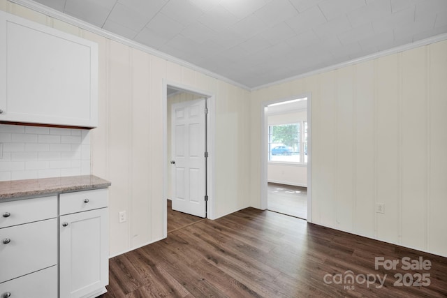 612 Summerow Rd Lot 22, Stanley, NC 28164 - unfurnished dining area featuring dark wood finished floors and ornamental molding