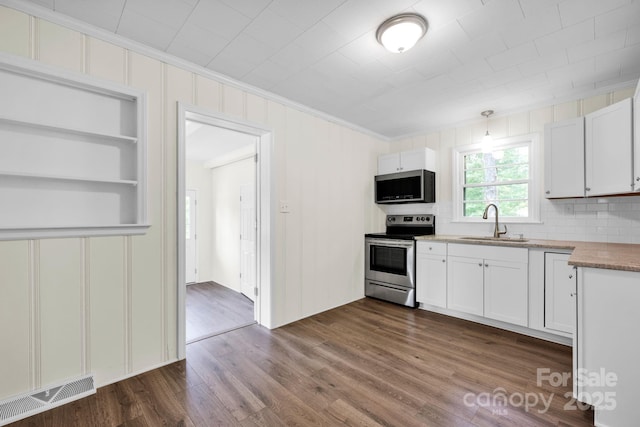 612 Summerow Rd Lot 22, Stanley, NC 28164 - kitchen featuring visible vents, a sink, ornamental molding, stainless steel appliances, and dark wood-type flooring