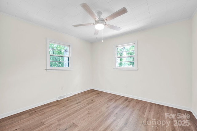 612 Summerow Rd Lot 22, Stanley, NC 28164 - empty room featuring visible vents, a ceiling fan, light wood finished floors, and plenty of natural light