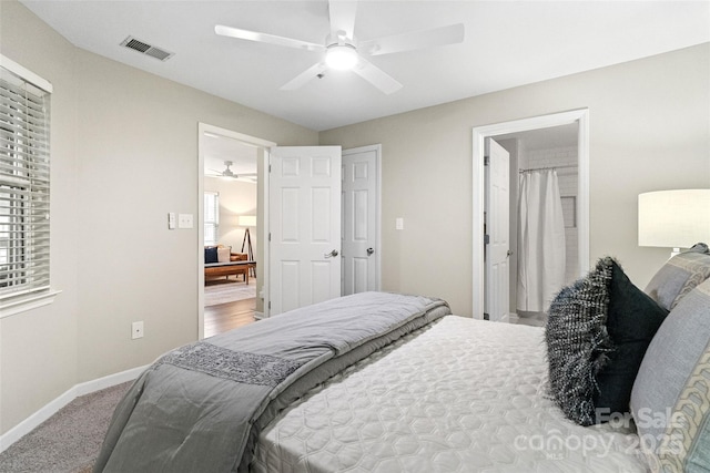 carpeted bedroom featuring baseboards and a ceiling fan