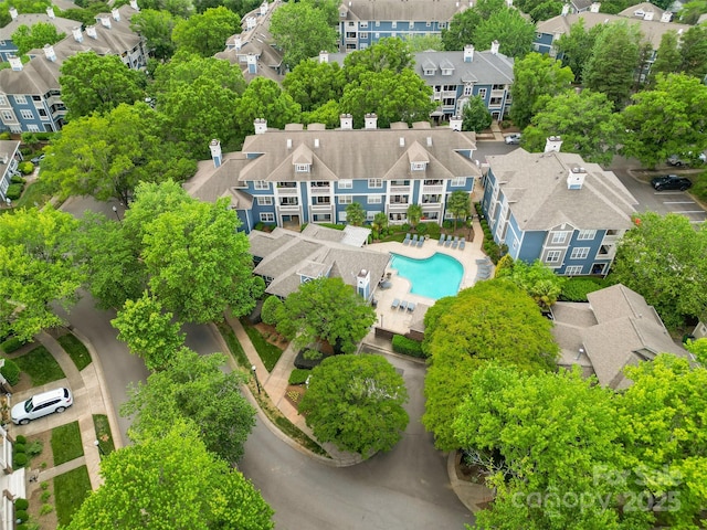 aerial view of residential area with a pool