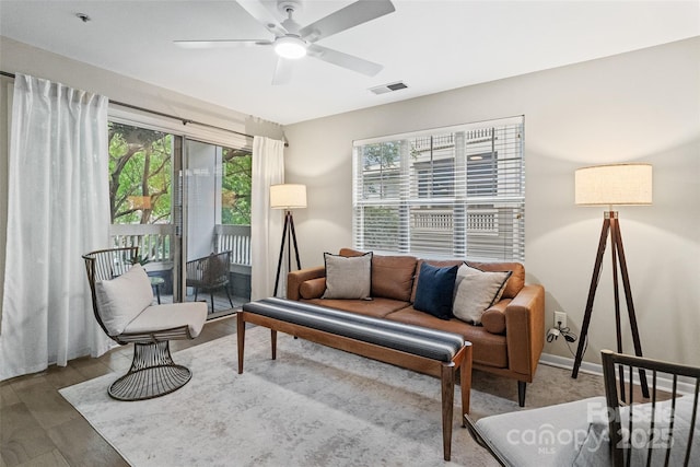 living room featuring a ceiling fan