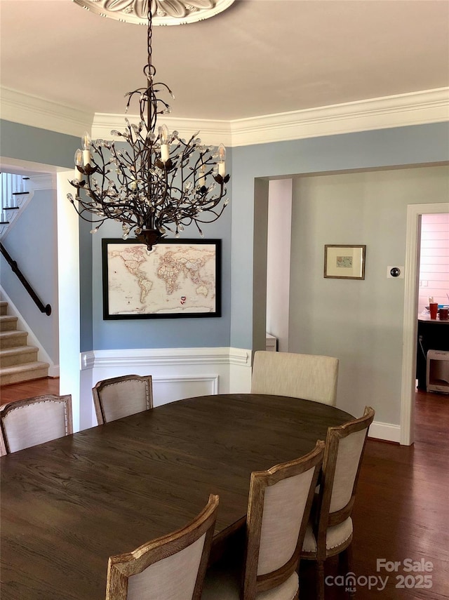 19409 Laurel Glen Ave, Cornelius, NC 28031 - dining room featuring stairs, a chandelier, crown molding, dark wood-style flooring, and baseboards