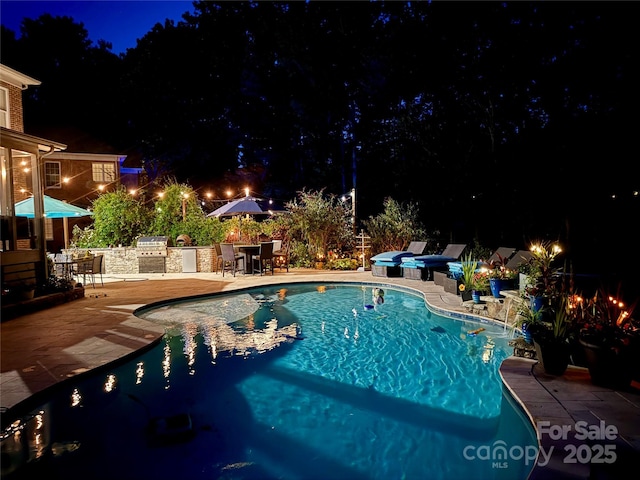 19409 Laurel Glen Ave, Cornelius, NC 28031 - pool at twilight featuring a patio, a hot tub, area for grilling, and an outdoor pool