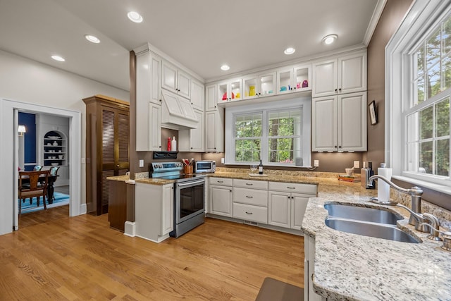 100 Poplar Spring Trl, Hendersonville, NC 28739 - kitchen featuring electric range, white cabinetry, recessed lighting, light stone countertops, and light wood-style flooring