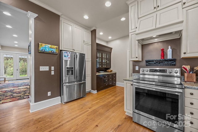 100 Poplar Spring Trl, Hendersonville, NC 28739 - kitchen with appliances with stainless steel finishes, light wood finished floors, recessed lighting, light stone countertops, and french doors