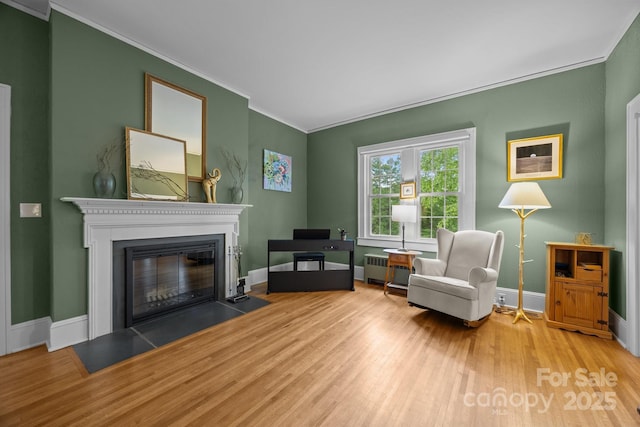 100 Poplar Spring Trl, Hendersonville, NC 28739 - living area with ornamental molding, wood finished floors, and a fireplace with flush hearth