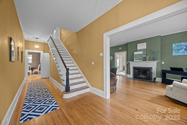 100 Poplar Spring Trl, Hendersonville, NC 28739 - staircase with wood finished floors and a fireplace with flush hearth