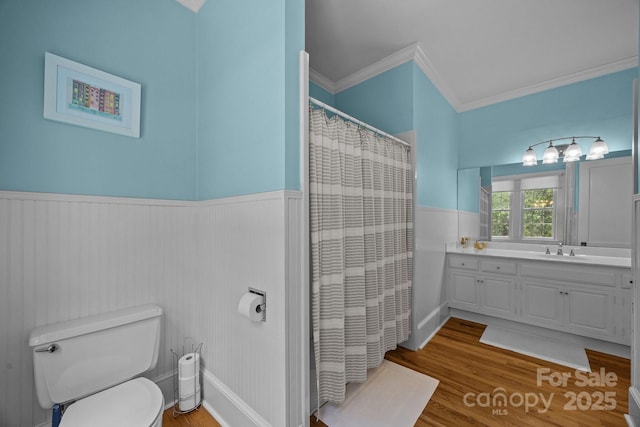 100 Poplar Spring Trl, Hendersonville, NC 28739 - bathroom featuring ornamental molding, vanity, a wainscoted wall, wood finished floors, and curtained shower