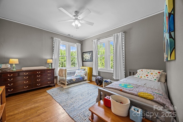 100 Poplar Spring Trl, Hendersonville, NC 28739 - bedroom with wood finished floors, crown molding, and a ceiling fan