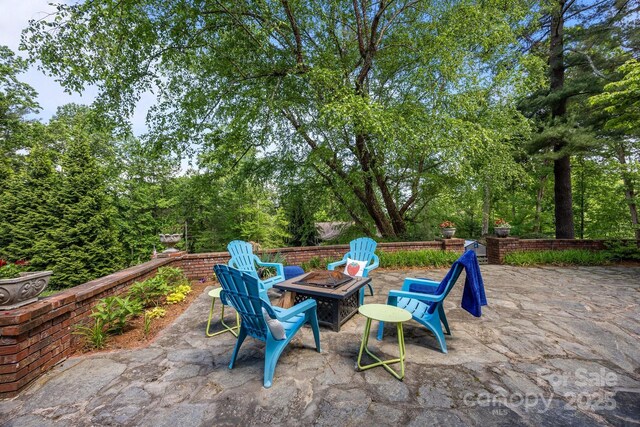 100 Poplar Spring Trl, Hendersonville, NC 28739 - view of patio / terrace featuring an outdoor fire pit