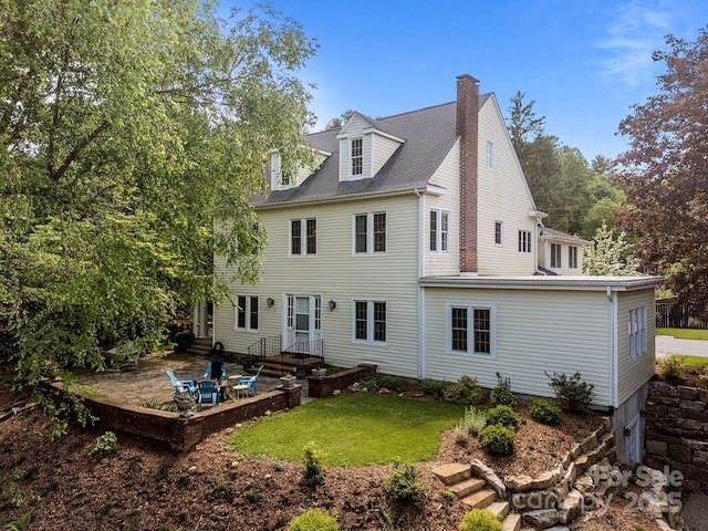 100 Poplar Spring Trl, Hendersonville, NC 28739 - rear view of property featuring a chimney, a yard, and a patio area