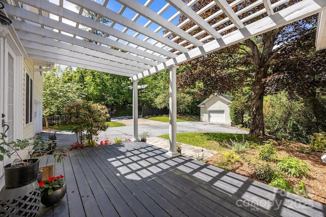 100 Poplar Spring Trl, Hendersonville, NC 28739 - wooden terrace featuring an outbuilding, a garage, a pergola, driveway, and a patio area