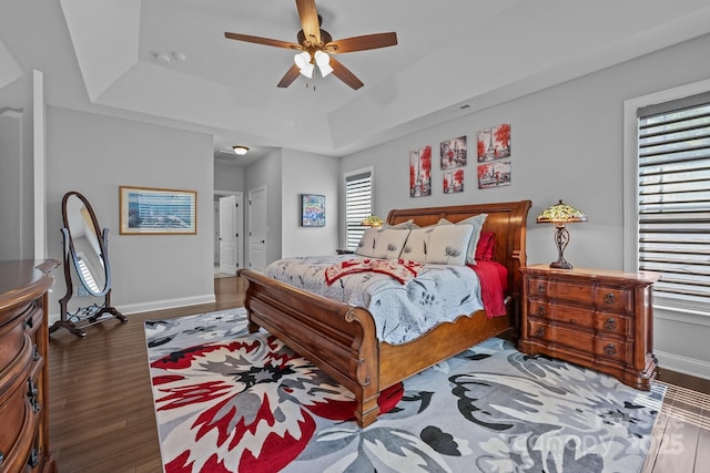 11621 Mount Argus Dr, Cornelius, NC 28031 - bedroom featuring a tray ceiling, wood finished floors, and a ceiling fan