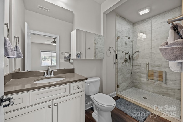 11621 Mount Argus Dr, Cornelius, NC 28031 - bathroom featuring a shower stall, vanity, wood finished floors, and a ceiling fan