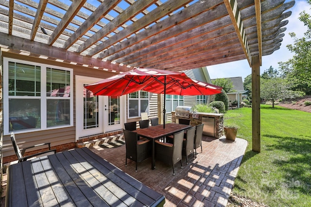 11621 Mount Argus Dr, Cornelius, NC 28031 - wooden deck featuring a pergola, a yard, outdoor dining area, and exterior kitchen