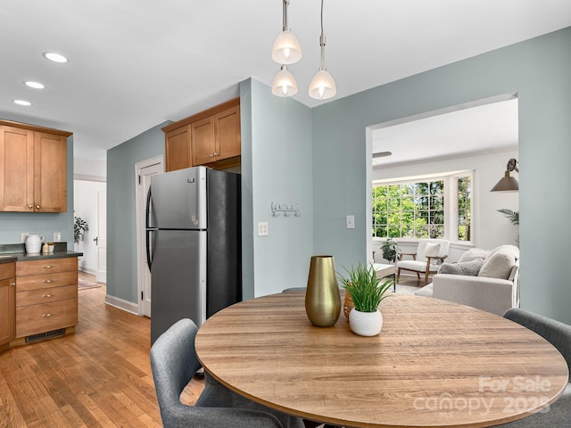 21 Clairmont Ave, Asheville, NC 28804 - dining area with light wood finished floors, recessed lighting, and baseboards