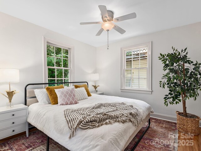 21 Clairmont Ave, Asheville, NC 28804 - bedroom with wood finished floors, baseboards, and a ceiling fan