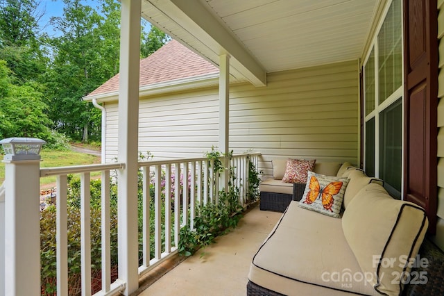 balcony featuring a porch and outdoor lounge area