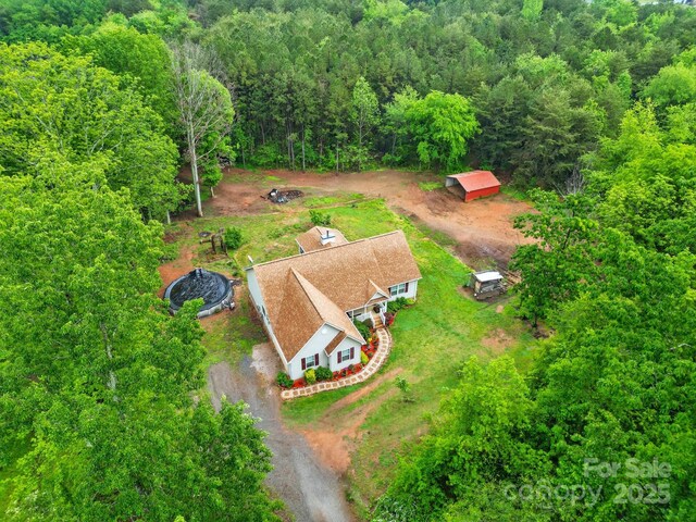 aerial view with a wooded view