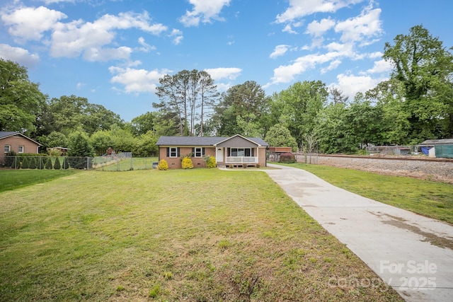 1211 Mirror Park Dr, Salisbury, NC 28146 - bungalow featuring a porch, concrete driveway, a front lawn, and fence