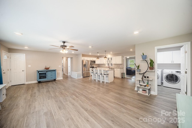 1211 Mirror Park Dr, Salisbury, NC 28146 - living room featuring recessed lighting, independent washer and dryer, a ceiling fan, and light wood-style flooring