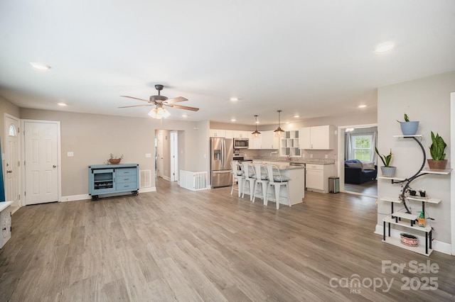 1211 Mirror Park Dr, Salisbury, NC 28146 - living room with visible vents, recessed lighting, and light wood-style floors