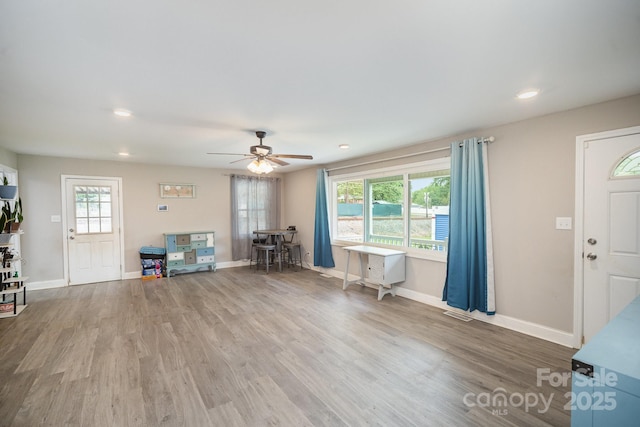 1211 Mirror Park Dr, Salisbury, NC 28146 - foyer entrance featuring wood finished floors, ceiling fan, and baseboards