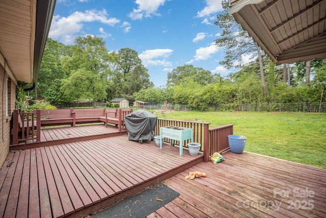 1211 Mirror Park Dr, Salisbury, NC 28146 - wooden deck with a lawn, a storage unit, an outdoor structure, and a fenced backyard