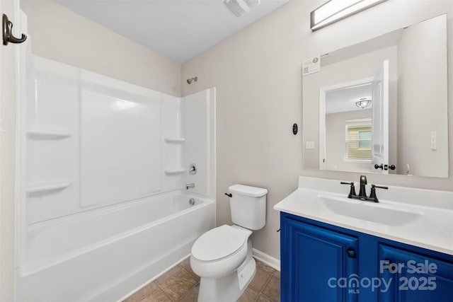 bathroom with toilet, vanity, baseboards, and shower / bathtub combination