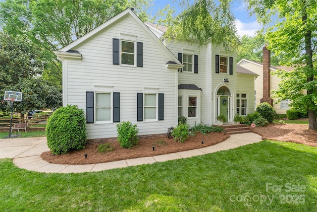 view of front of home with a front yard