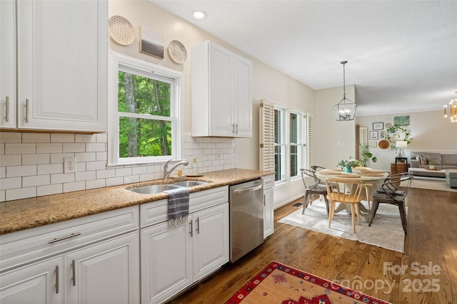 kitchen featuring stainless steel dishwasher, a chandelier, white cabinets, backsplash, and dark wood-style floors