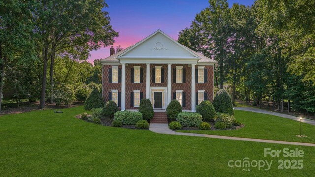 1721 White Pond Ln, Waxhaw, NC 28173 - neoclassical / greek revival house with a lawn and brick siding