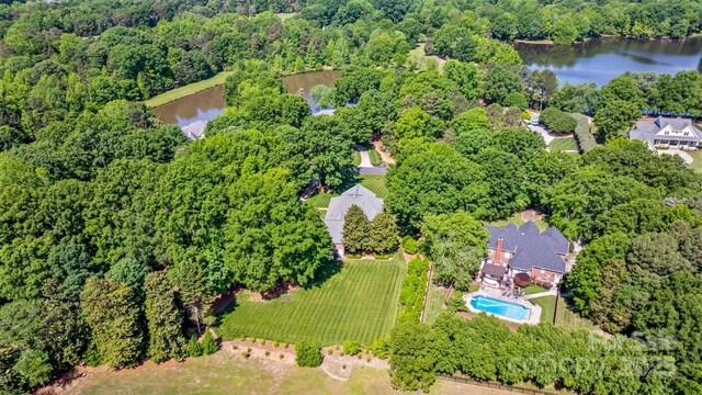 1721 White Pond Ln, Waxhaw, NC 28173 - drone / aerial view of a nearby body of water, a forest, and a pool area