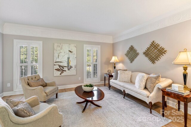 1721 White Pond Ln, Waxhaw, NC 28173 - living room with crown molding, plenty of natural light, light wood finished floors, and baseboards