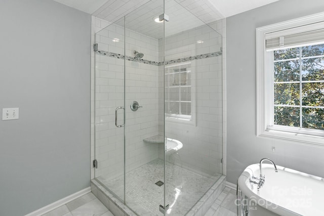 1721 White Pond Ln, Waxhaw, NC 28173 - full bath with a soaking tub, baseboards, a shower stall, and plenty of natural light