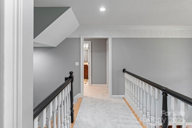 1721 White Pond Ln, Waxhaw, NC 28173 - corridor featuring an upstairs landing, carpet floors, crown molding, baseboards, and recessed lighting