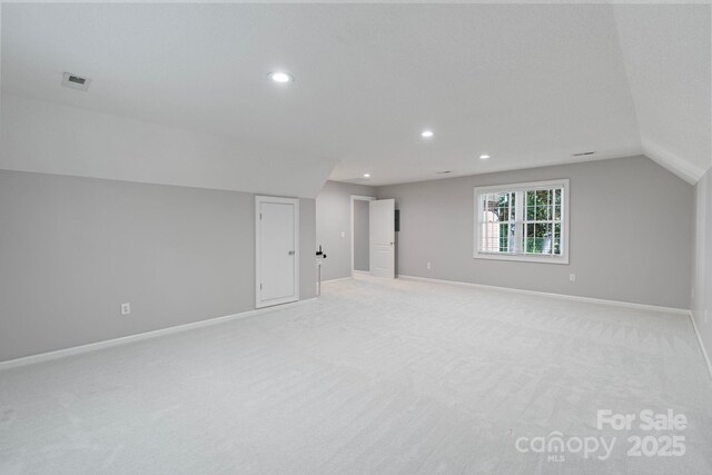 1721 White Pond Ln, Waxhaw, NC 28173 - empty room featuring recessed lighting, light colored carpet, baseboards, and lofted ceiling