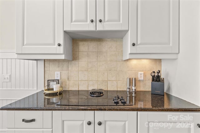 7923 Mountain Shore Dr, Sherrills Ford, NC 28673 - kitchen with white cabinetry, dark stone countertops, and decorative backsplash