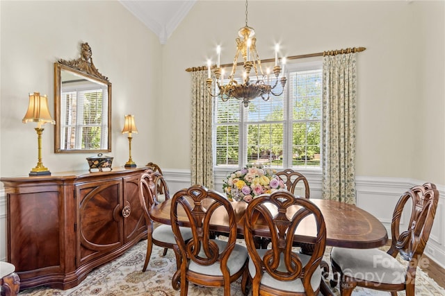 7923 Mountain Shore Dr, Sherrills Ford, NC 28673 - dining room featuring a chandelier, crown molding, wainscoting, a decorative wall, and vaulted ceiling