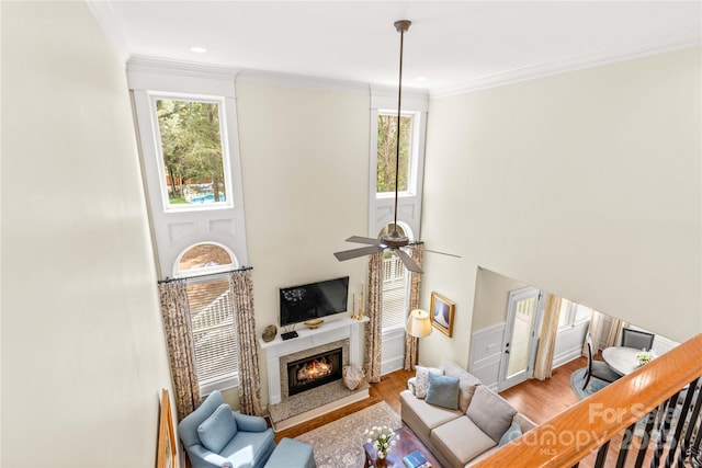 7923 Mountain Shore Dr, Sherrills Ford, NC 28673 - living room featuring a fireplace, light wood finished floors, healthy amount of natural light, crown molding, and ceiling fan