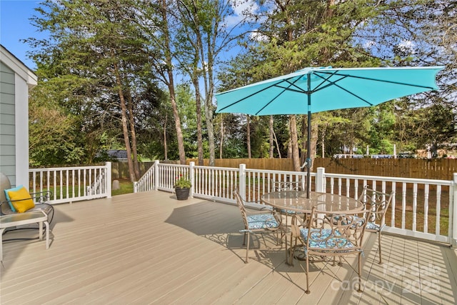 7923 Mountain Shore Dr, Sherrills Ford, NC 28673 - deck featuring outdoor dining area, a fenced backyard, and view of wooded area