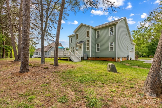 7923 Mountain Shore Dr, Sherrills Ford, NC 28673 - rear view of property with crawl space, an attached garage, a lawn, a deck, and driveway