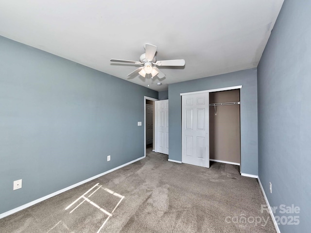 unfurnished bedroom with a closet, carpet flooring, ceiling fan, and baseboards