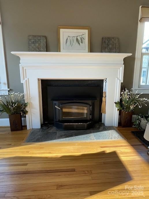 detailed view of a wood stove and wood finished floors