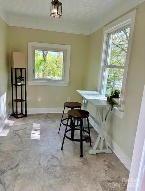 dining space featuring baseboards
