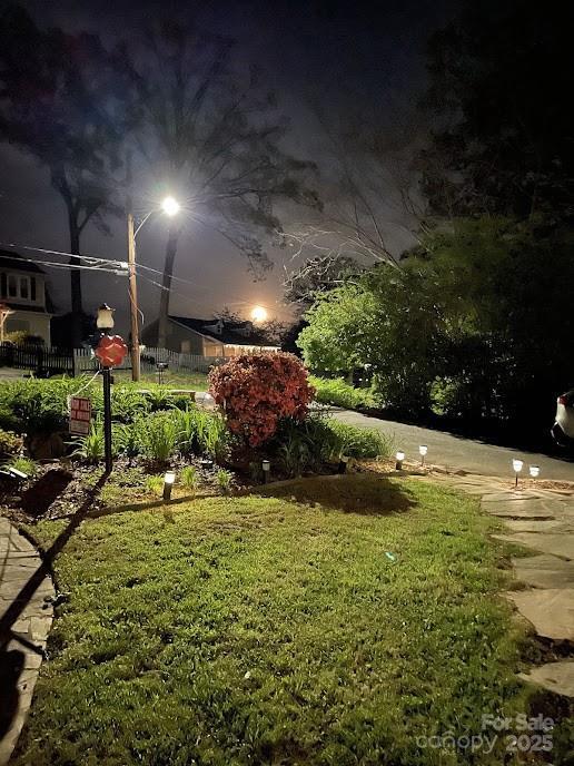 view of yard at twilight