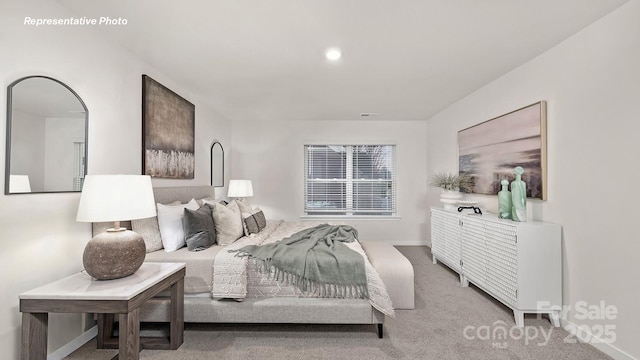 carpeted bedroom with baseboards
