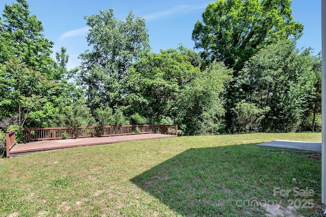 view of yard with a wooden deck