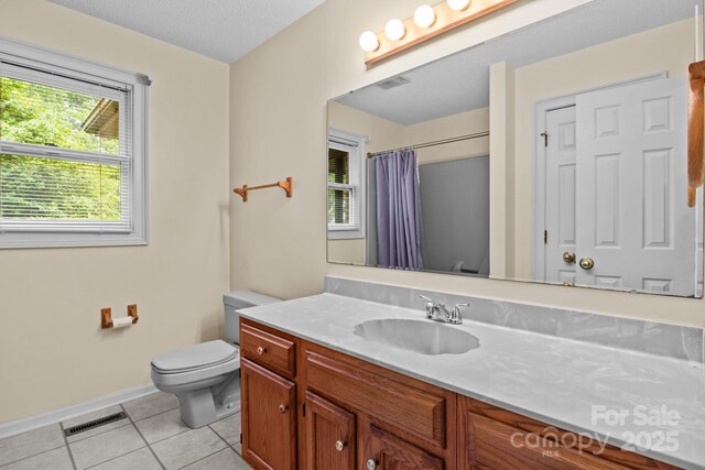 bathroom featuring baseboards, tile patterned flooring, toilet, and visible vents
